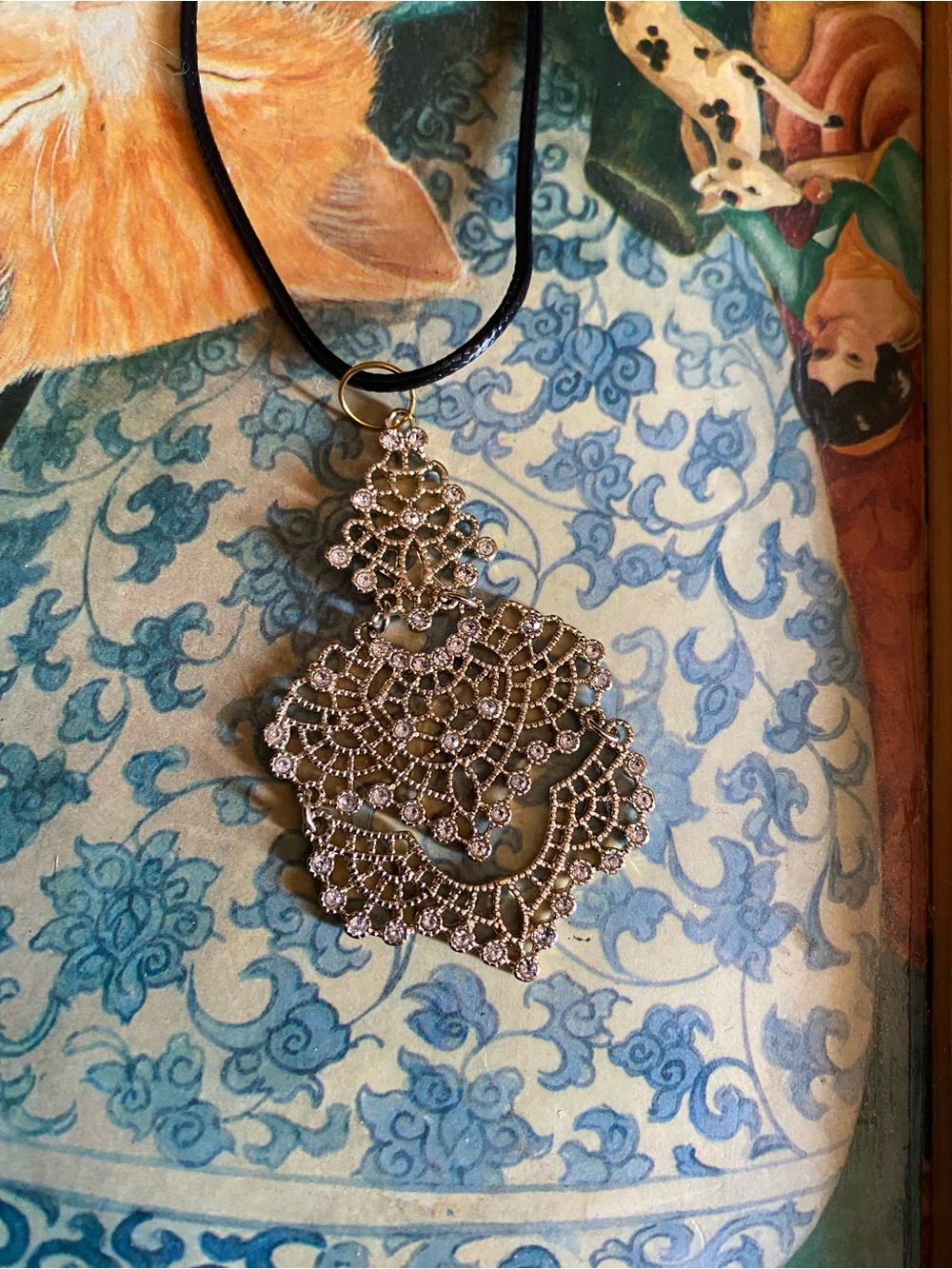 Boho Chandelier: Ornate gold-Tone Crystal Filigree Pendant Necklace - black cord